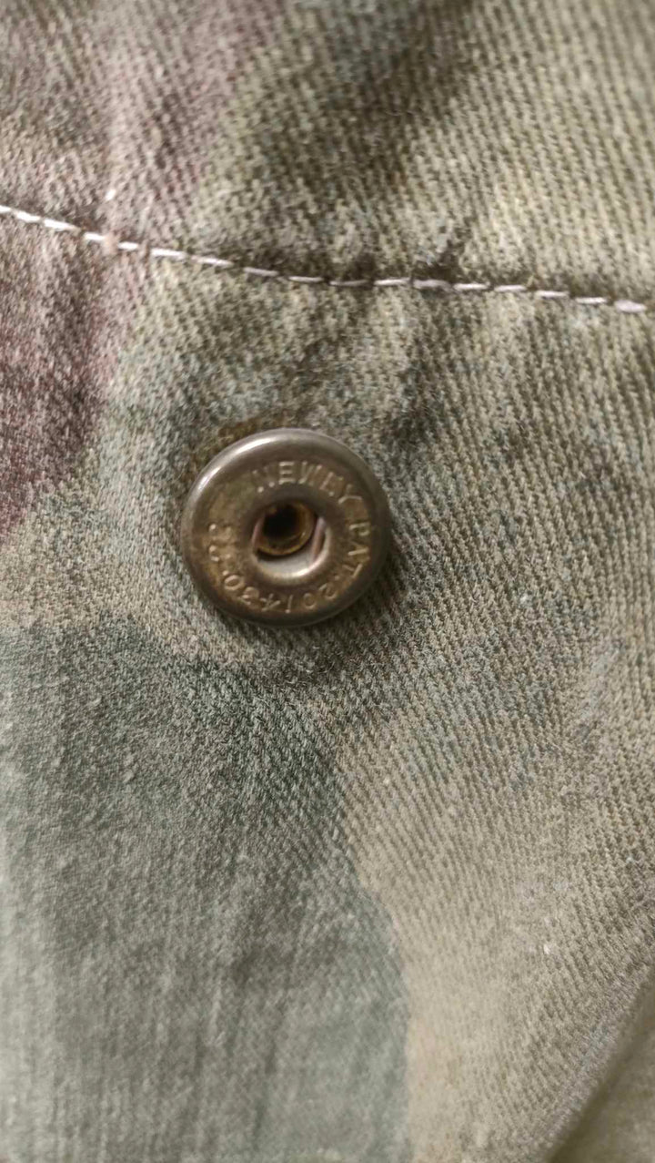 close up of metal popper button