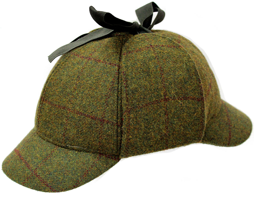 Green wool tweed deerhunter style hat with checked pattern and earflaps tied at the top with black ribbon