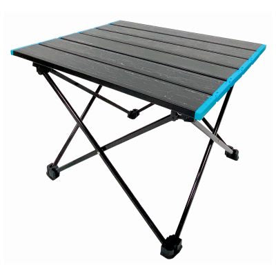 black fold away camping table with blue edge detail