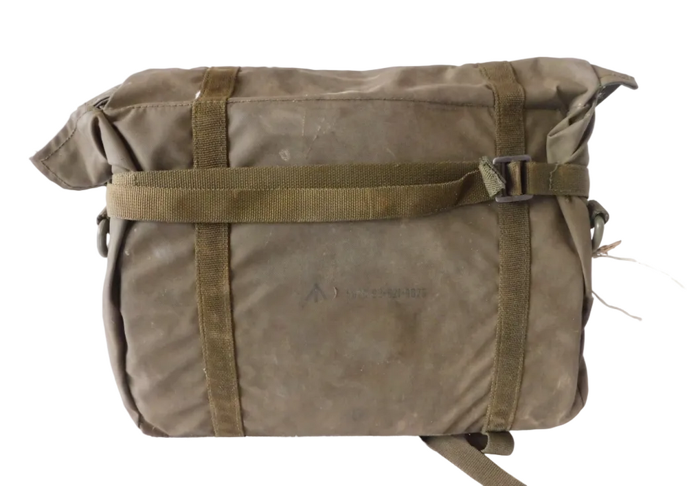 An olive green military-style canvas roll-top bag with a roll-top flap, two vertical webbing straps, and a horizontal buckle strap across the front, photographed against a plain white background.