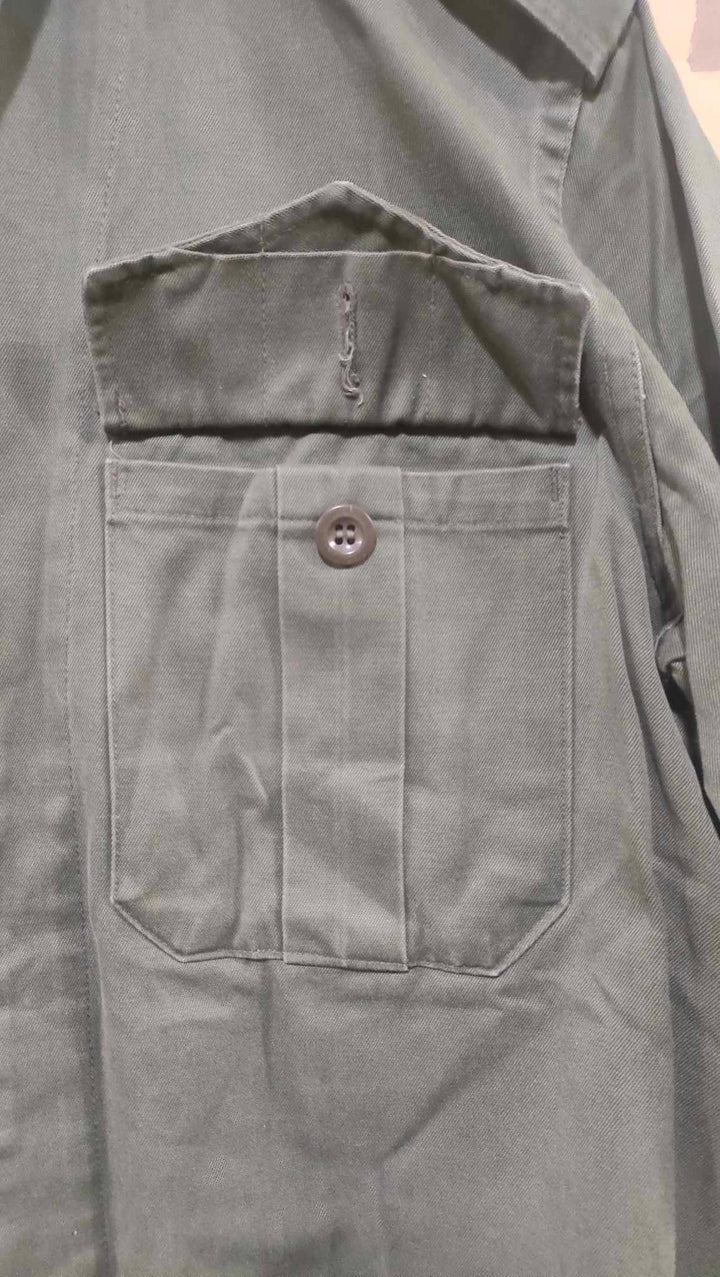 close up view of breast pocket with button