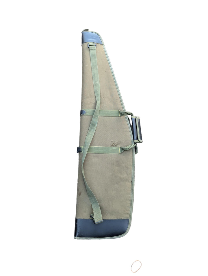 Green and blue fishing rod bag on a gray pavement