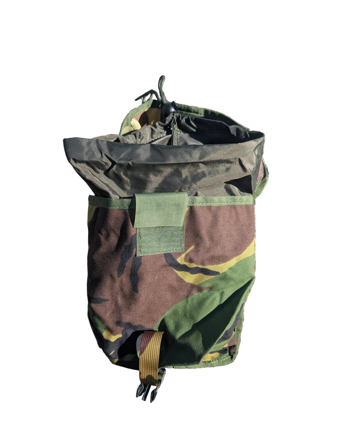 Camouflage bag on a textured surface