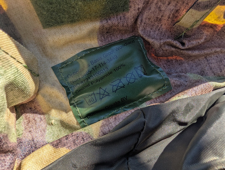 Green battery pack inside a multicolored fabric bag