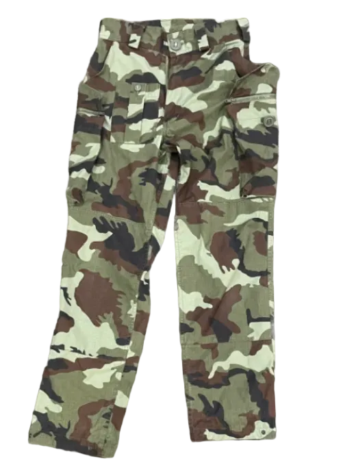 A pair of camouflage cargo pants in a classic woodland pattern of green, brown, black, and beige, laid flat against a white background.