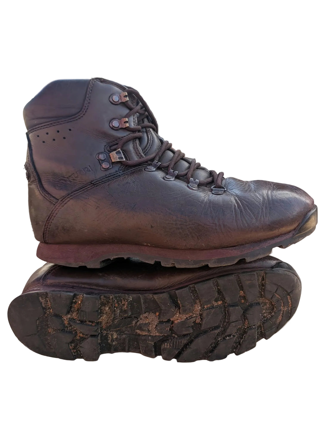 A dark brown leather lace-up boot with a rugged sole, shown resting on top of another boot&