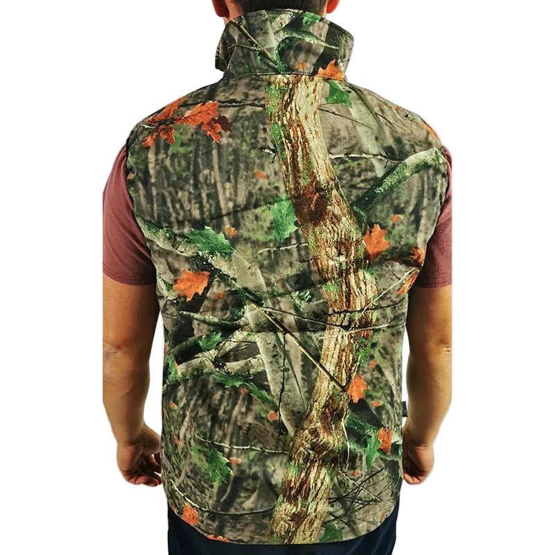A man viewed from the back wearing a sleeveless high-collar vest with a realistic tree-bark camouflage pattern in green, brown, and orange, layered over a maroon t-shirt.