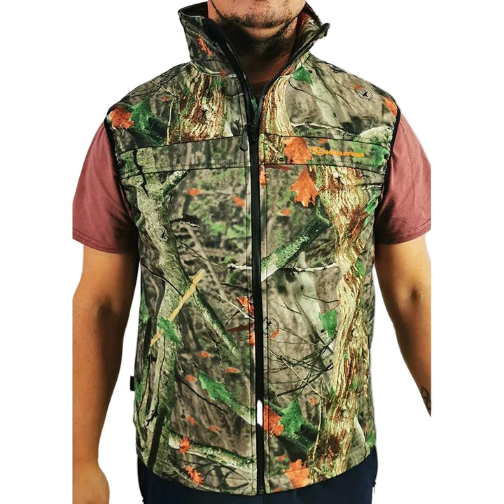 A man wearing a sleeveless zip-front vest with a woodland camouflage pattern featuring green, brown, and orange leaves over a brown short-sleeve shirt, shown against a plain light background.
