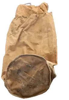 Brown leather bag with visible wear on a blue tiled floor