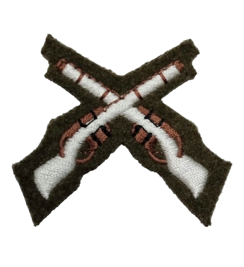 Embroidered patch of crossed rifles on a brown background