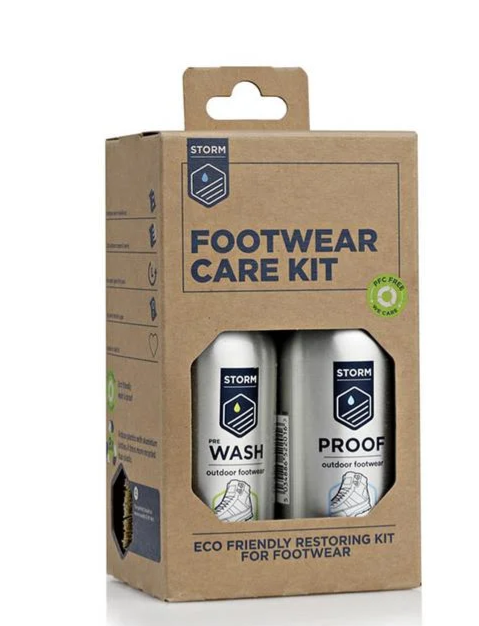 A brown cardboard box containing a Storm Footwear Care Kit with two silver bottles visible through a window, on a white background.
