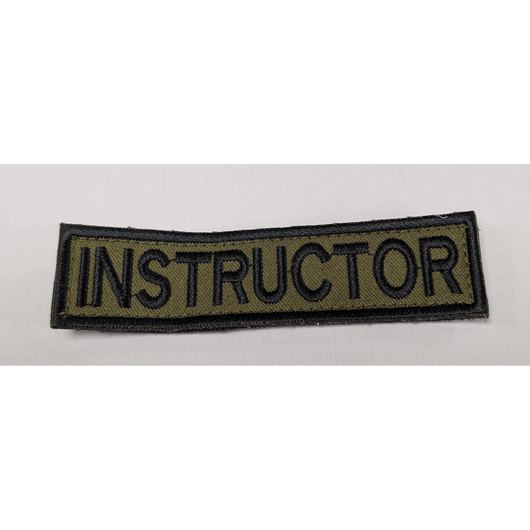 Patch with 'INSTRUCTOR' text on a white background