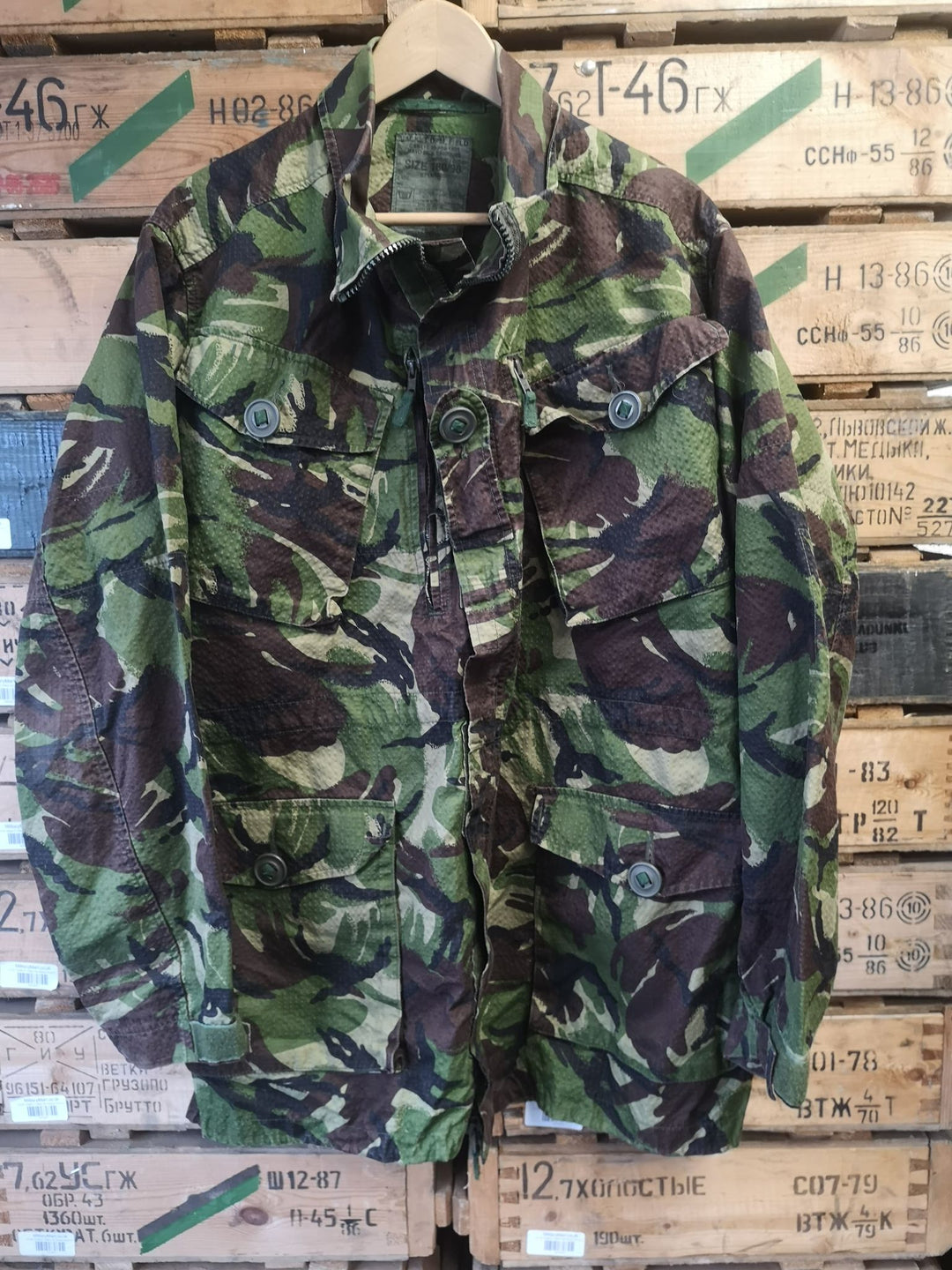 Dark green and brown camo jacket with four pockets